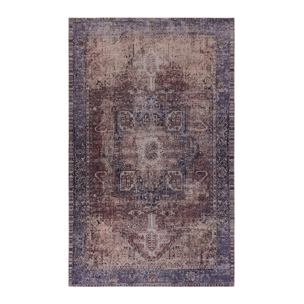 A rectangular distressed traditional rug with a faded medallion pattern in muted purple, mauve, brown, and beige tones, shown flat against a plain white background.