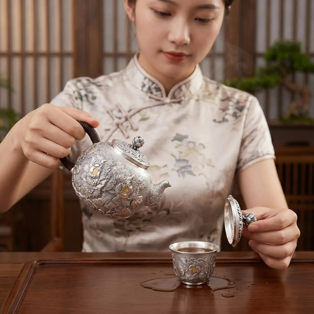 Pure 999 Fine Silver Artisanal Hand-Engraved Silver Teapot Featuring Intricate Peony Motifs and Woven Handle - Handicraft